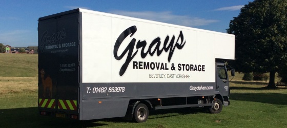 picture of three graydeliver removal vans